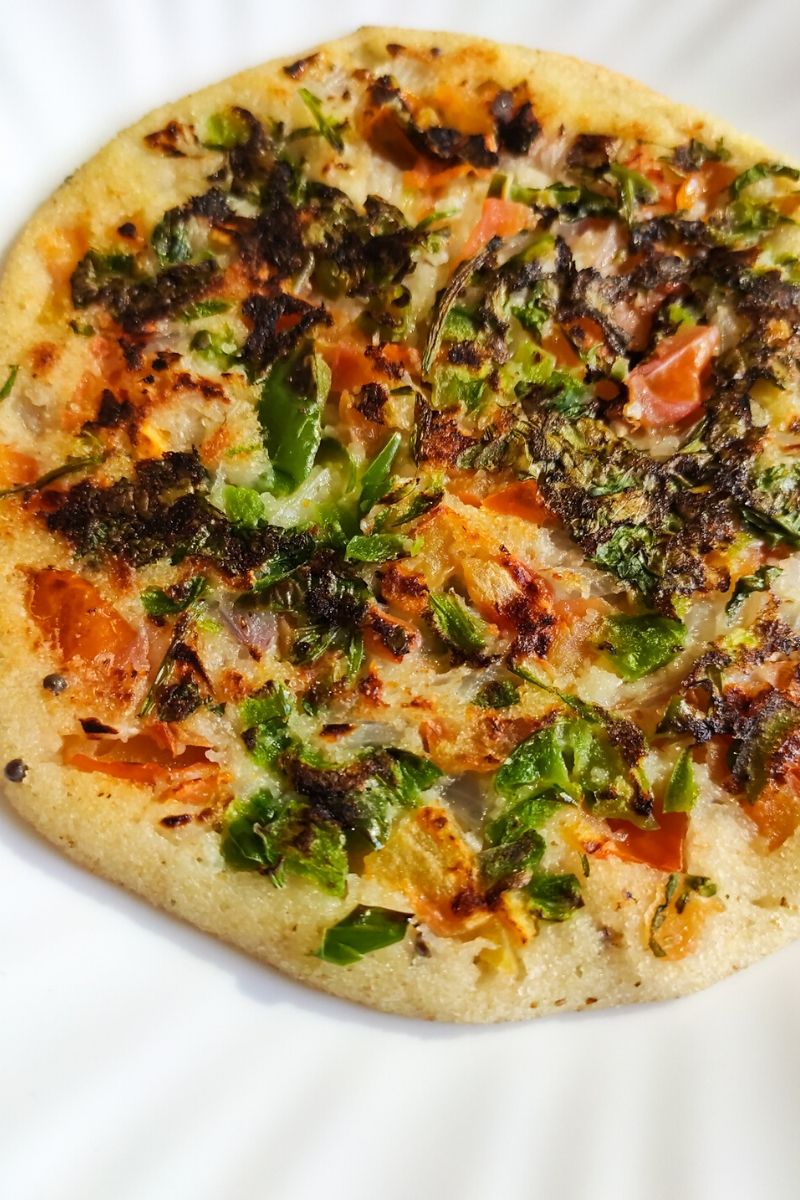 Rava Uttapam served on a white plate