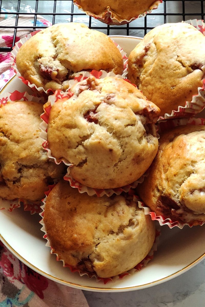 Close up shot of strawberry muffins kept in a white bowl