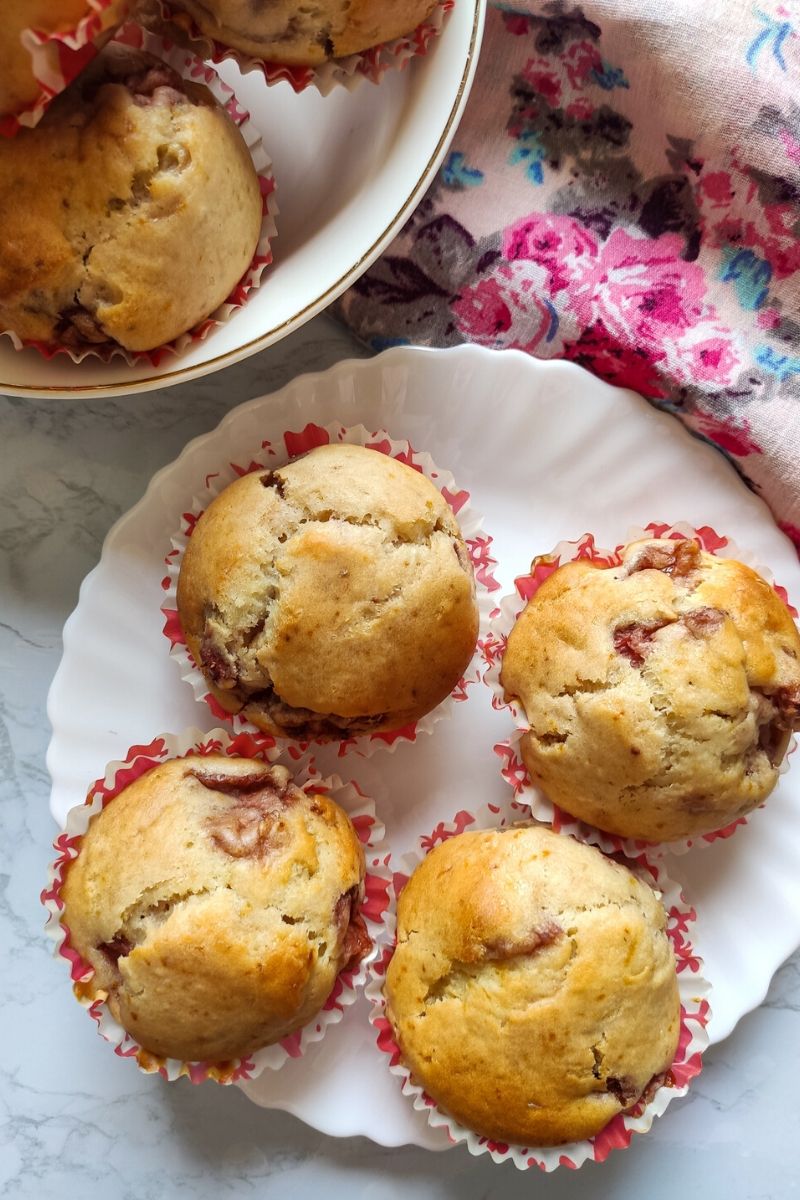 Vegan strawberry muffins served in a white plate and a white bowl