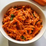 French carrot salad served in a white bowl