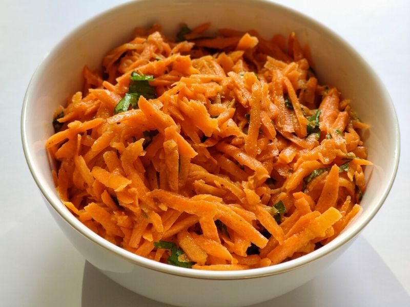 French carrot salad served in a white bowl