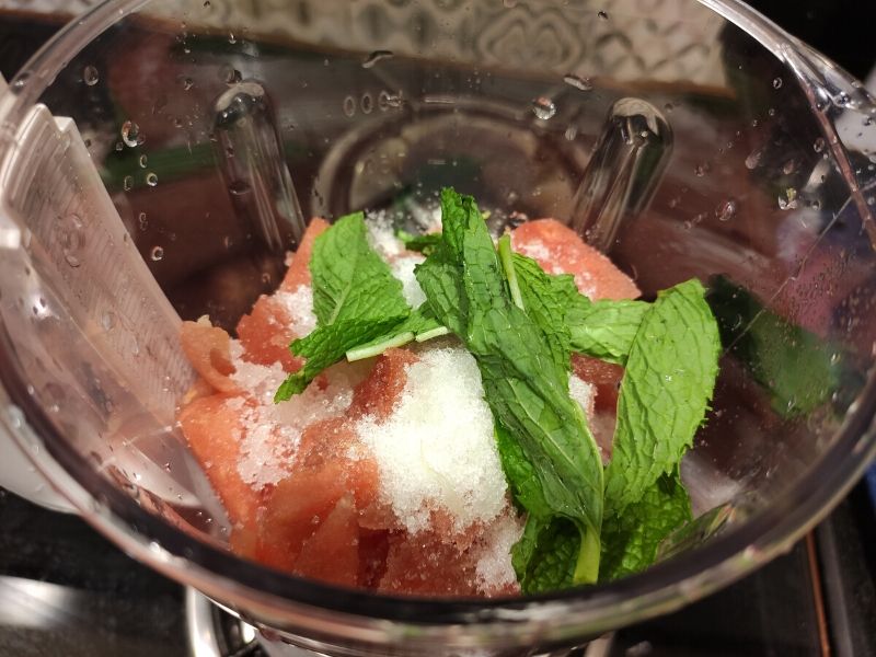 watermelon cubes, mint leaves, lemon juice, and sugar in a blender