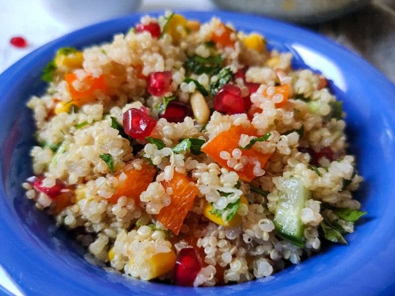 quinoa salad served in a blue bowl