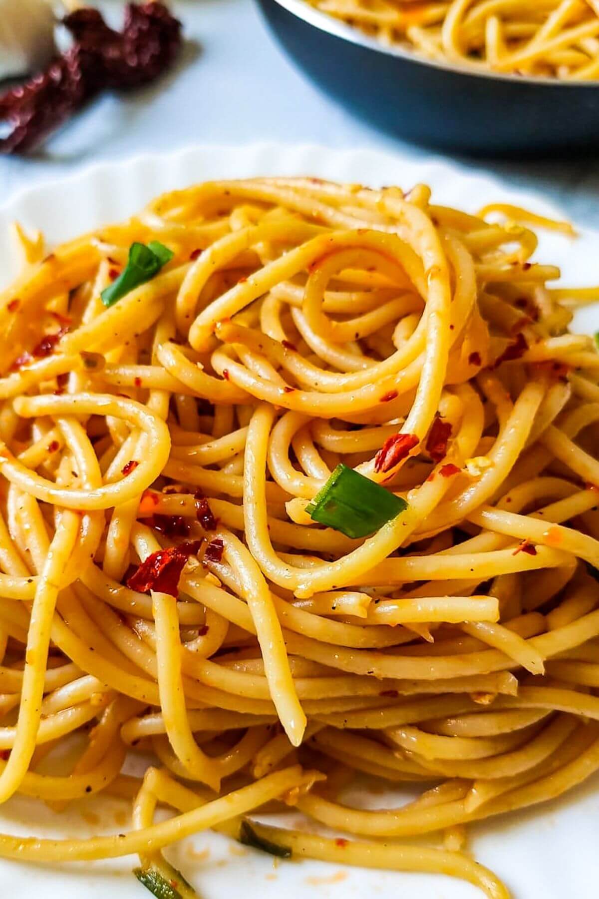 Spicy garlic noodles on a plate.
