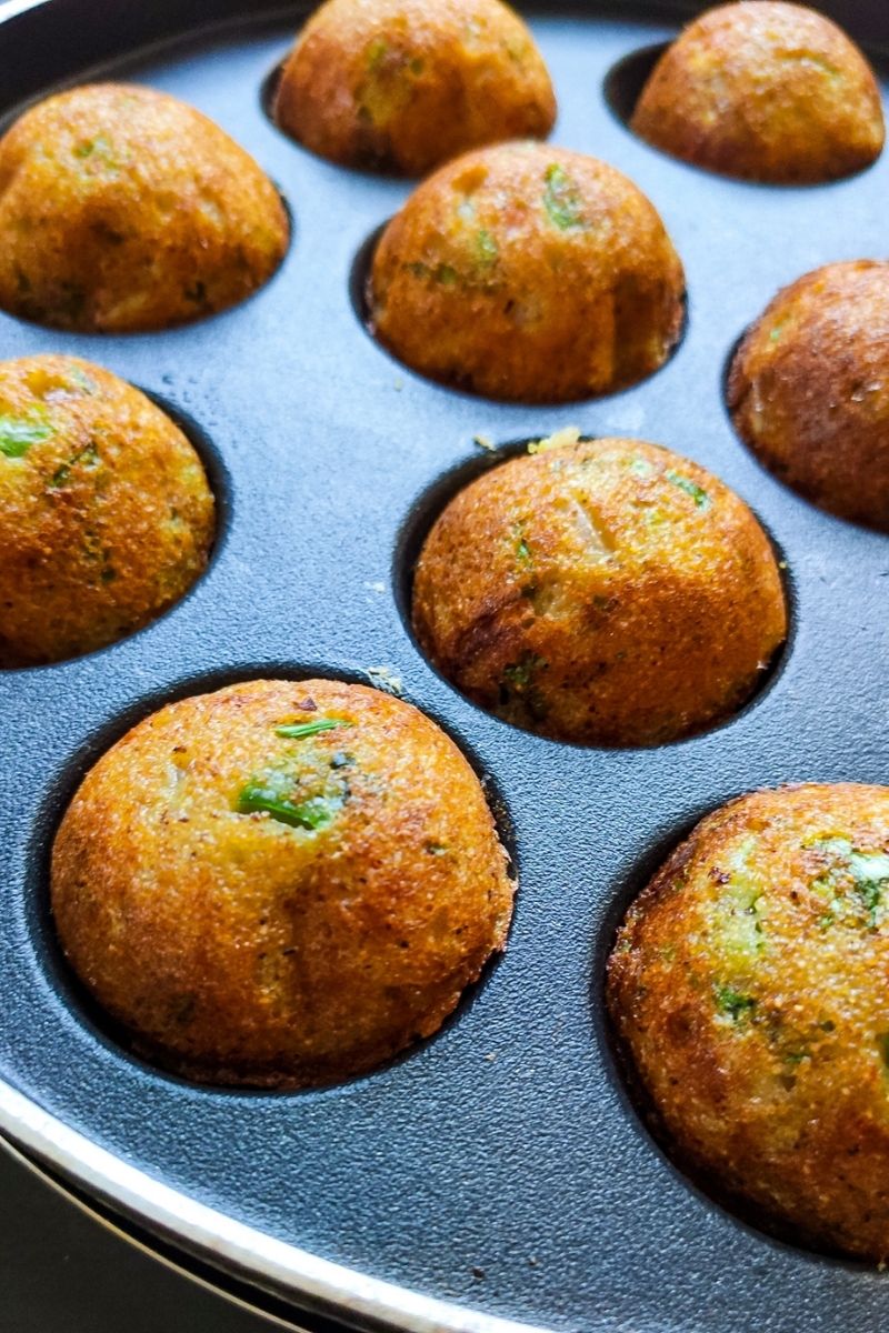 Vegetable paniyaram in a paniyaram pan