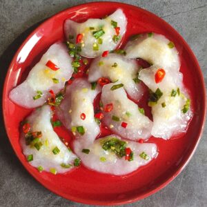 Vegan Vietnamese dumplings served on a red plate