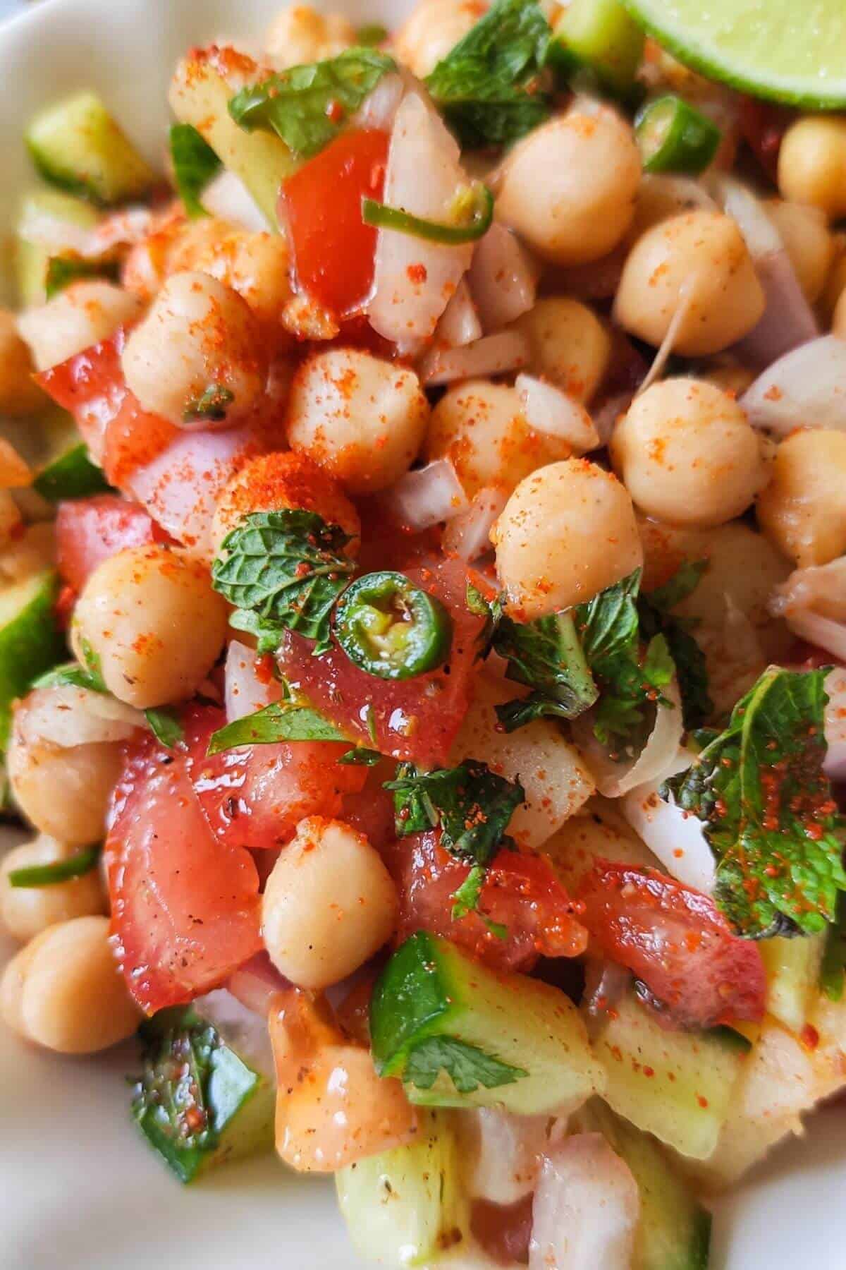 Simple Indian style chickpea salad served on a white plate