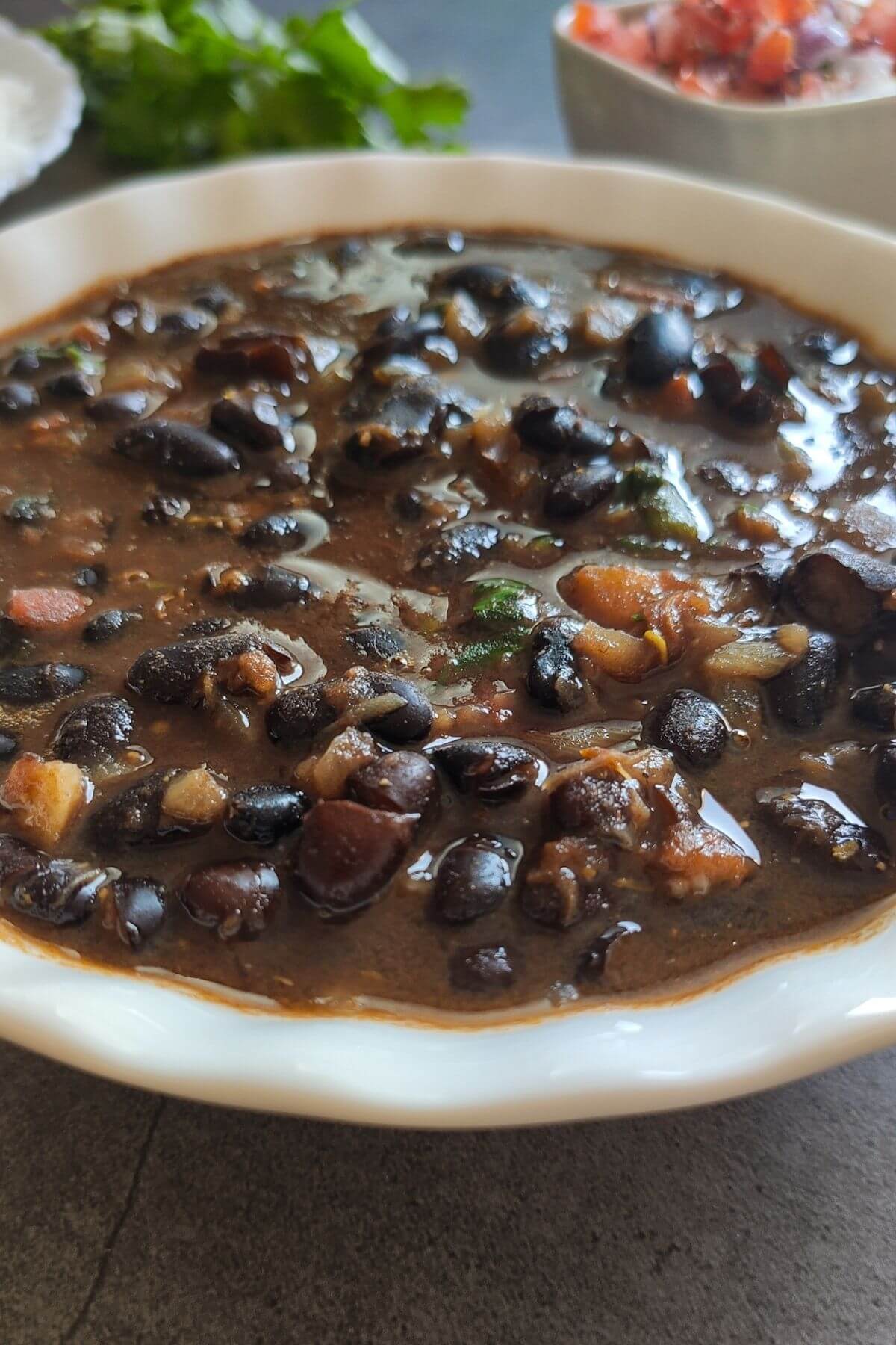 vegan black bean curry in a white bowl