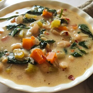 Cannellini bean soup in a white bowl