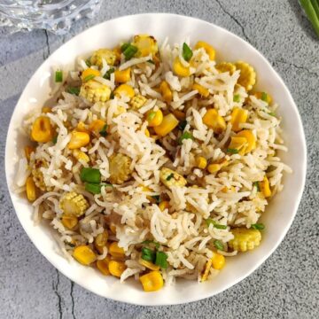 corn fried rice served in a white bowl.