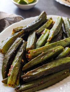 Stuffed bhindi served on a white dish.