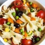 Pasta salad with vegetables in a white bowl