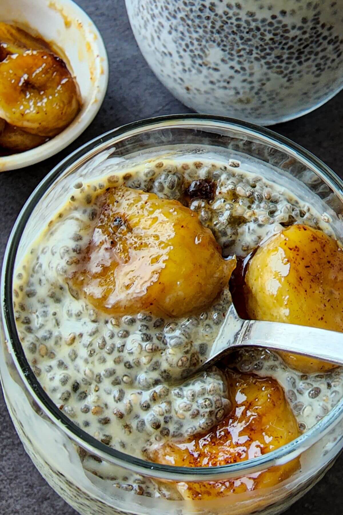 Chia pudding with caramelized bananas in a glass.