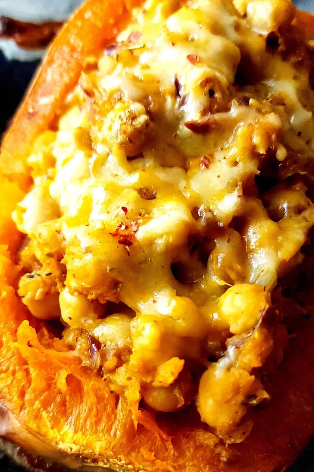 Baked butternut squash stuffed with chickpeas and cheese.