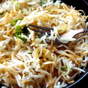 Lebanese vermicelli with rice in a bowl with a fork.
