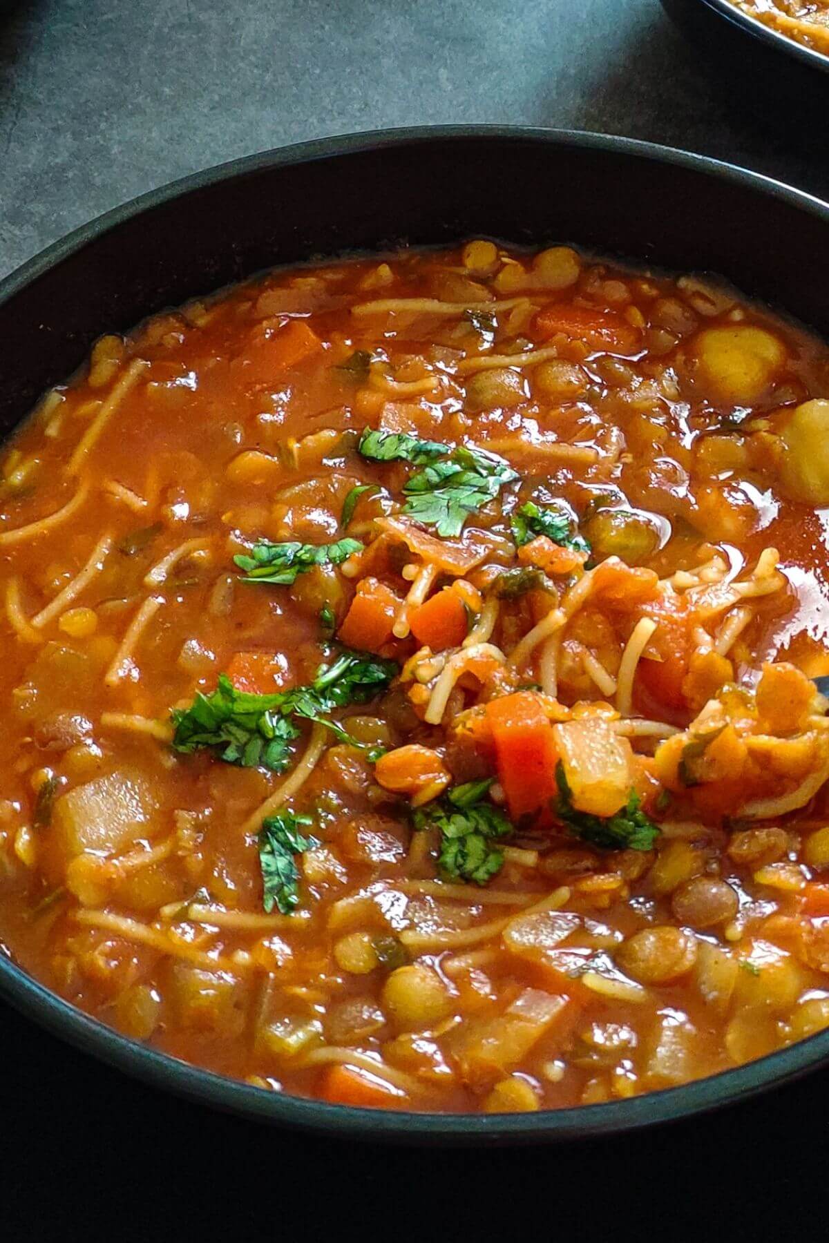 A bowl of Moroccan chickpea lentil soup harira.