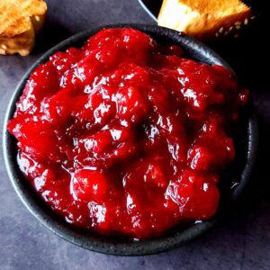 Indian plum chutney served in a black bowl.