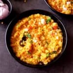 Toor dal khichdi in a black bowl.