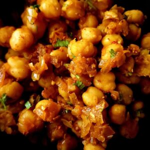 Sauteed chickpeas garnished with chopped cilantro.