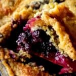 Cobbler with mixed frozen berries in a casserole dish.