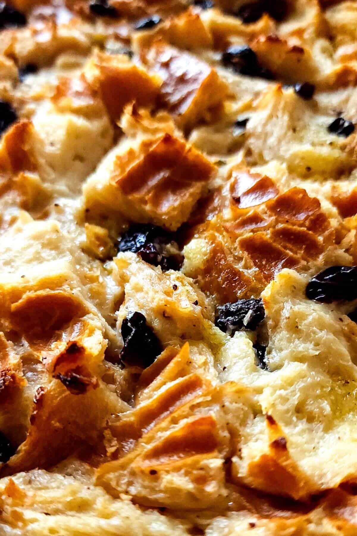 Vegan bread and butter pudding with black raisins.