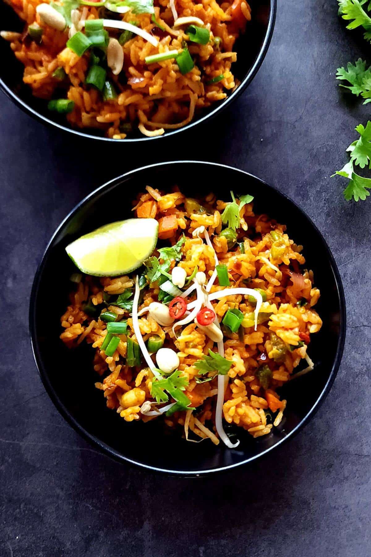 Two bowls of vegan Thai fried rice.