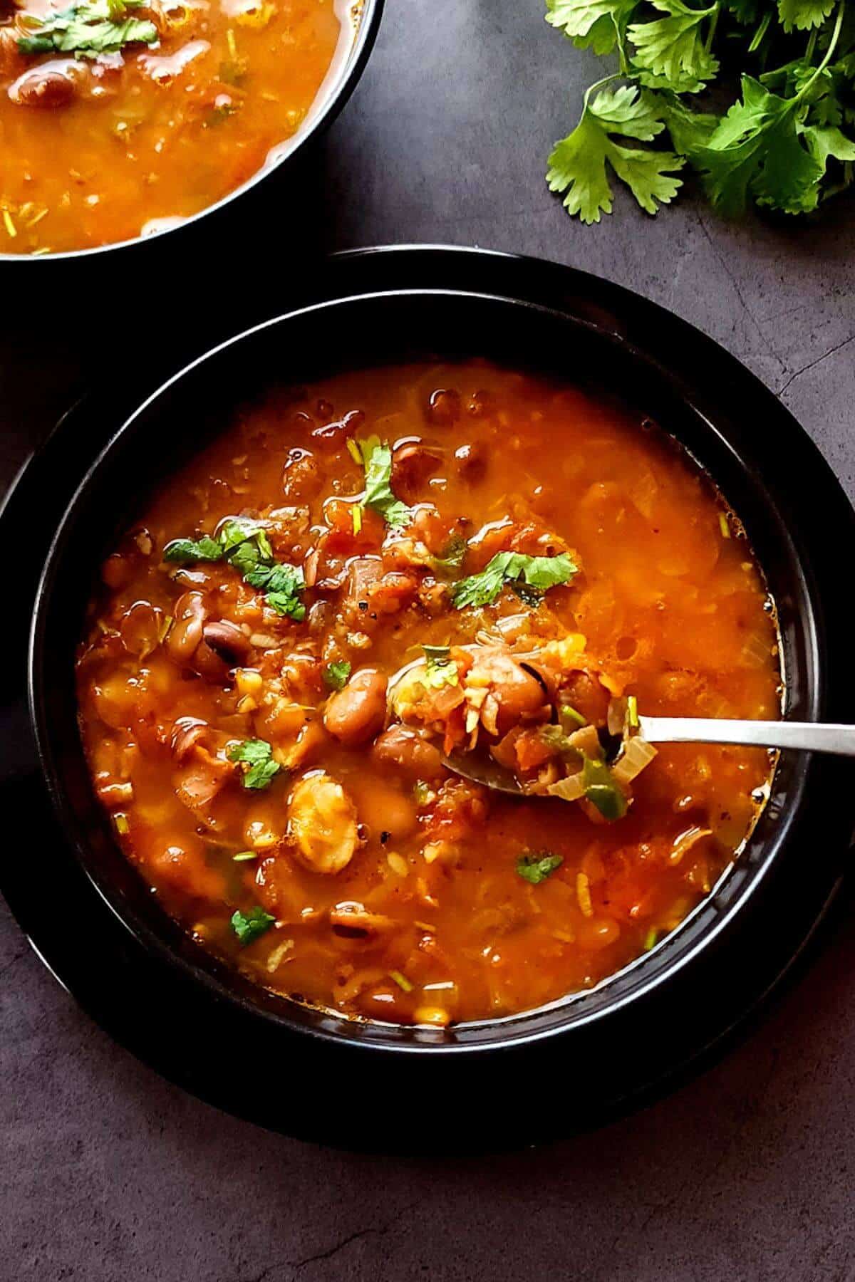 Two bowls of fava bean and tomato soup.