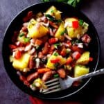 Turkish potato salad in a bowl with a fork.