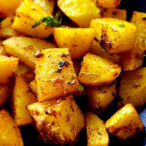 Close up shot of curry roasted potatoes.