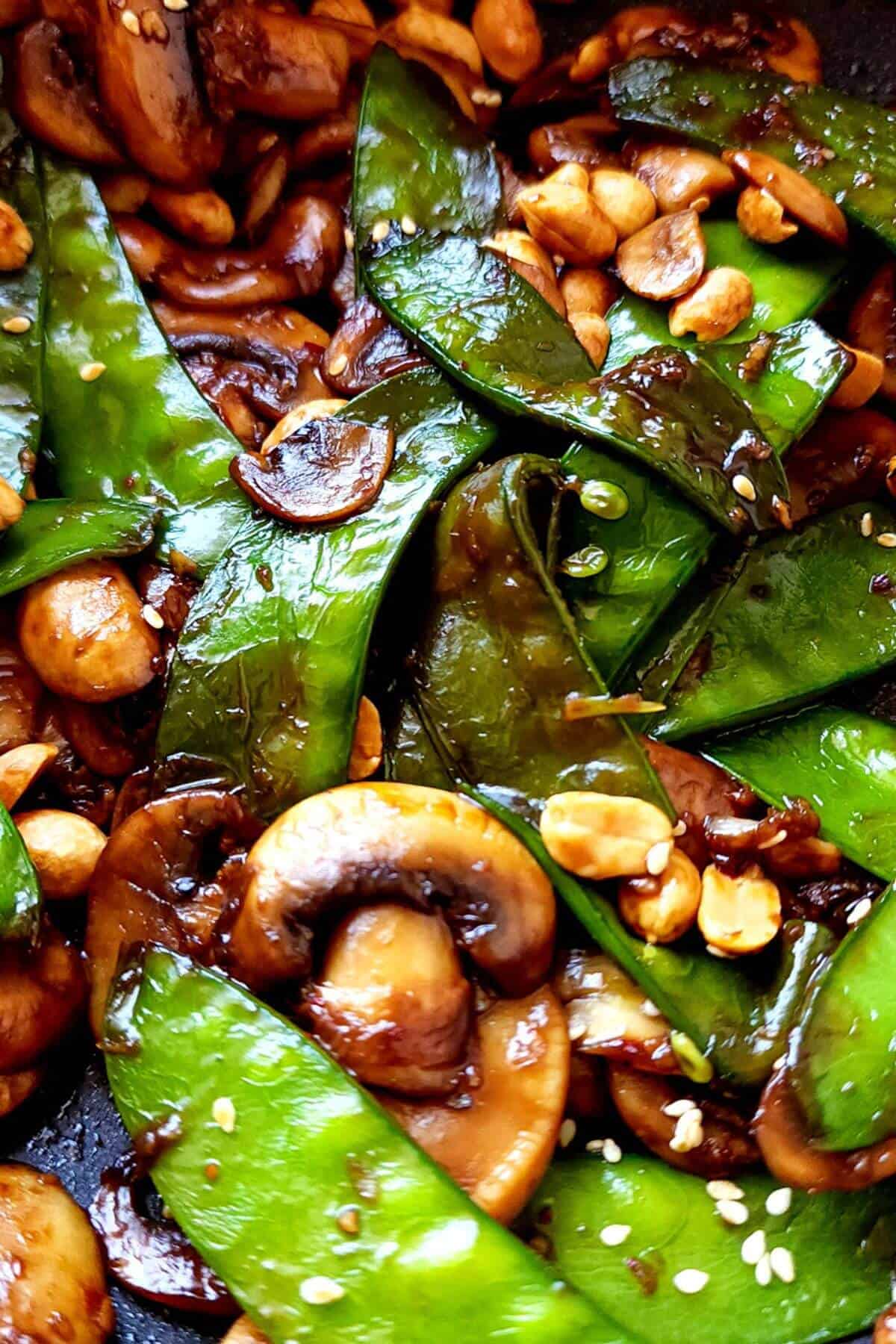 Sauteed mushrooms with snow peas, peanuts, and sesame seeds.