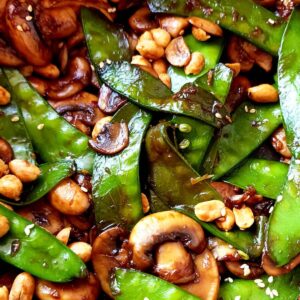 Close up shot of snow peas mushroom stir fry.