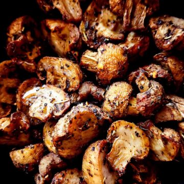 Closeup shot of seasoned air fryer mushrooms.